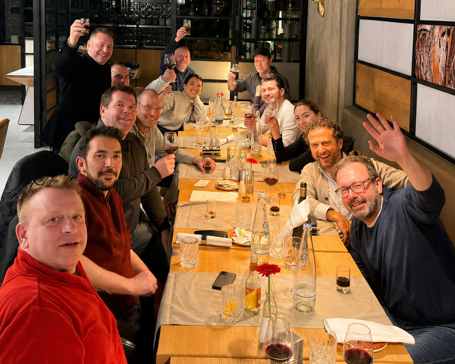 The Anonos team raising glasses in celebration.